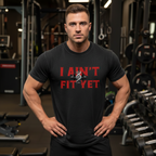 Black t-shirt with red text 'I AIN'T FIT YET' on a white background